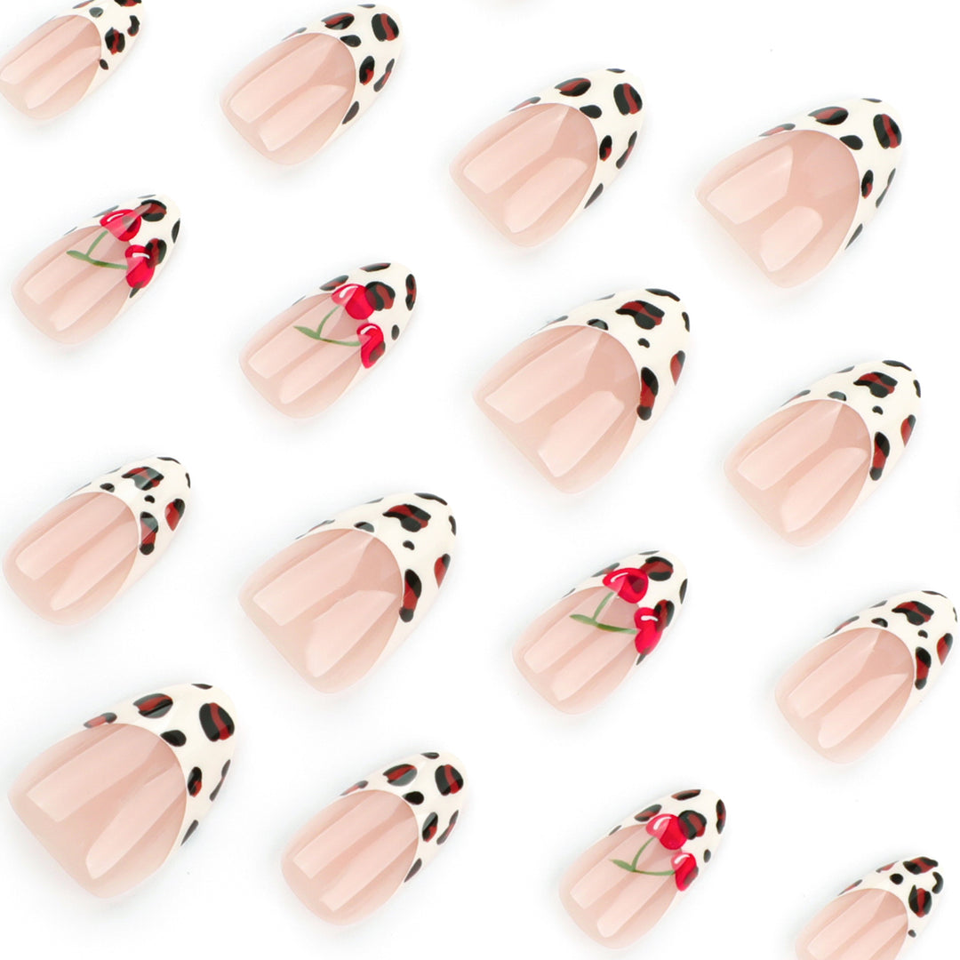 Artful animal pattern nails with cherry accents Bowlift