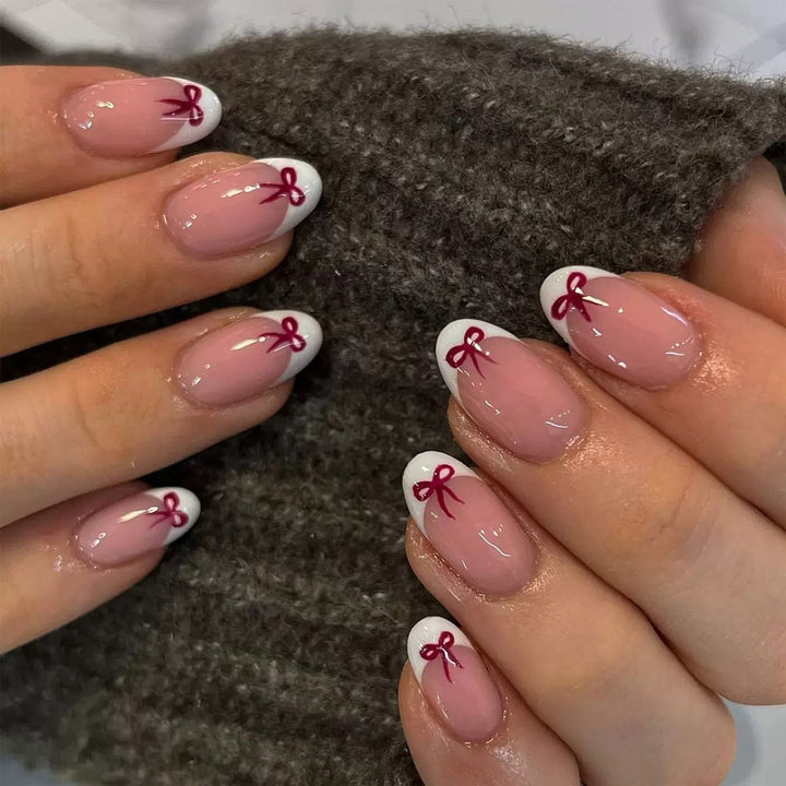 Artificial nail set with elegant bows and French tips Bowlift