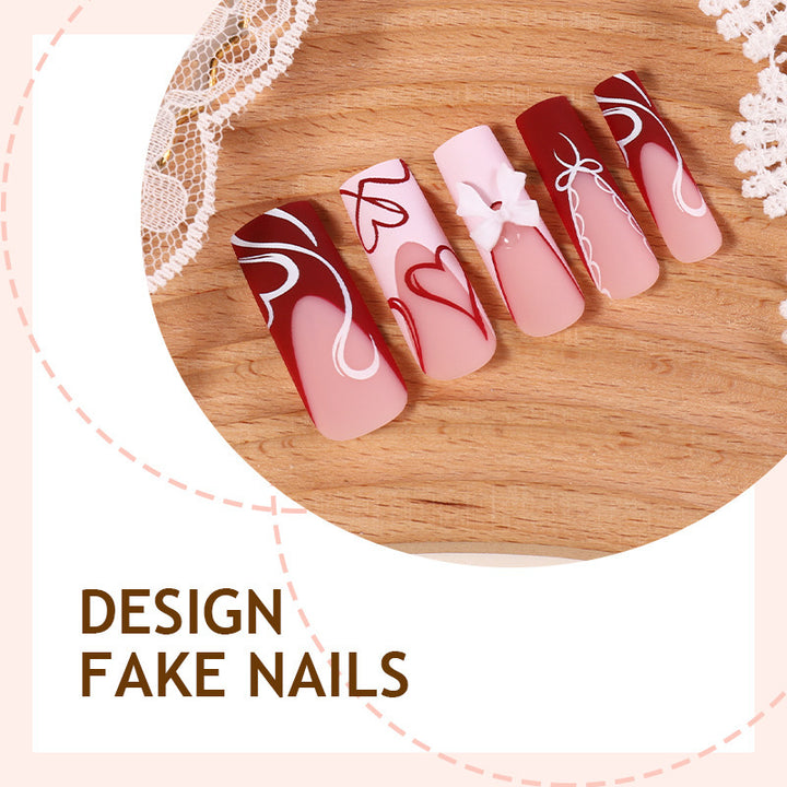 artistic nail set with heart and bow motifs Bowlift