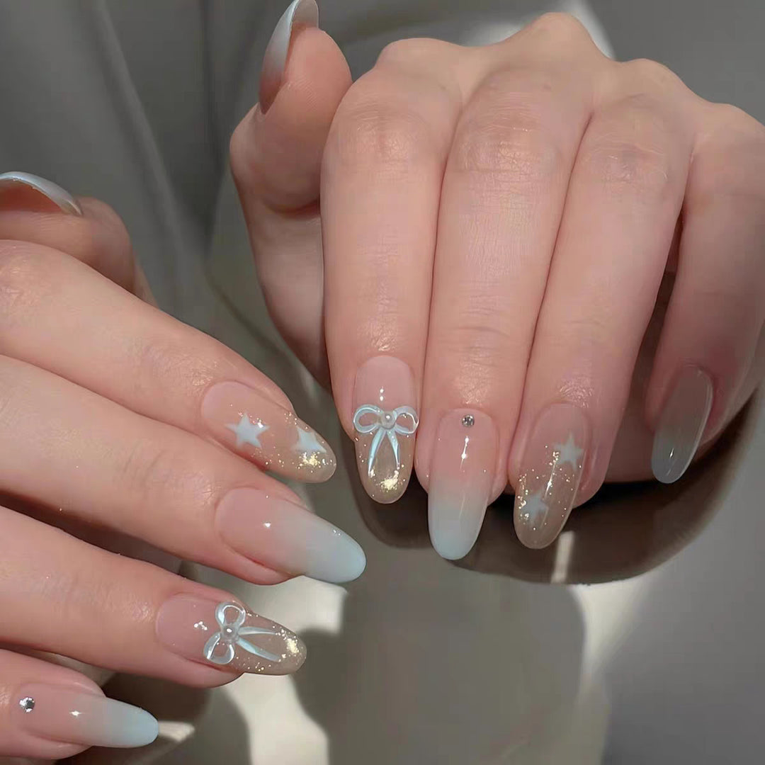 Artificial nails with elegant ombre effect and decorative accents Bowlift