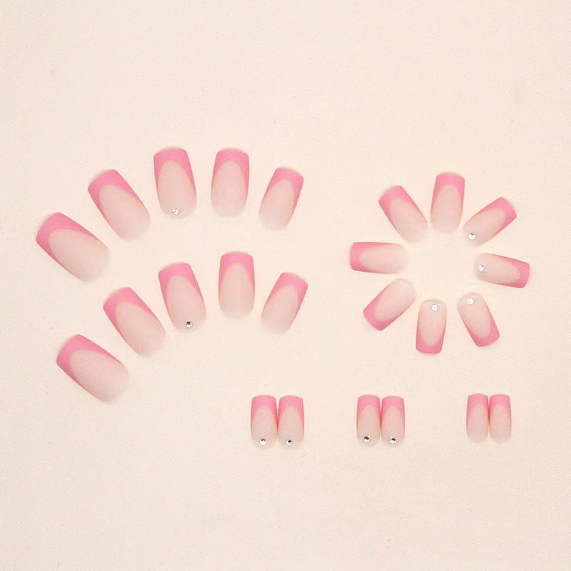 Nail set with elegant French design and glitter accents Bowlift