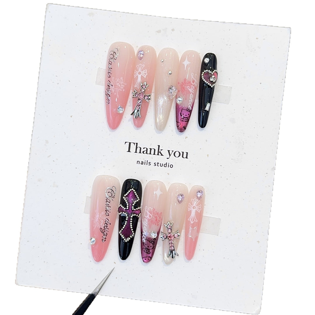 Artificial nails with glamorous accents and sparkling embellishments Bowlift