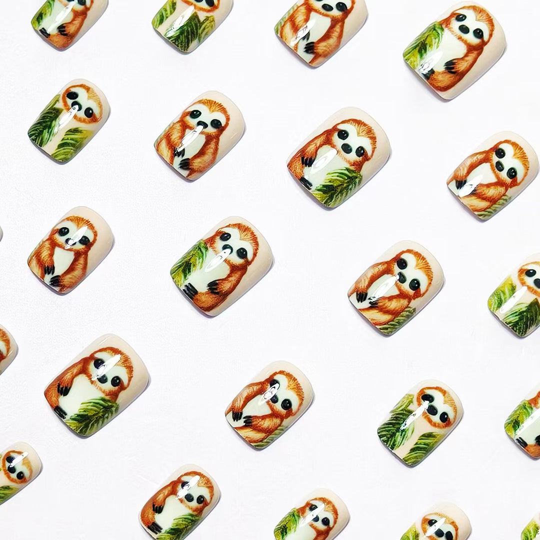Art nails with cute sloth and leaf design Bowlift