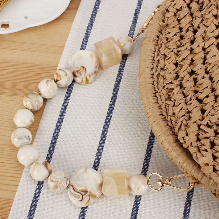 Shoulder bag with decorative shell design Bowlift