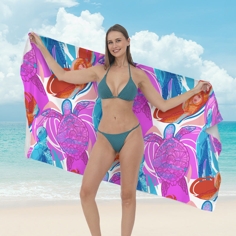 Beach towel with vibrant tropical plant motif Bowlift
