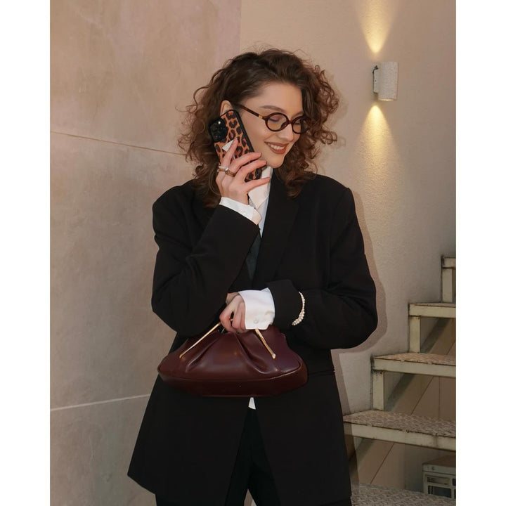 Designer handbag with unique handle Bowlift
