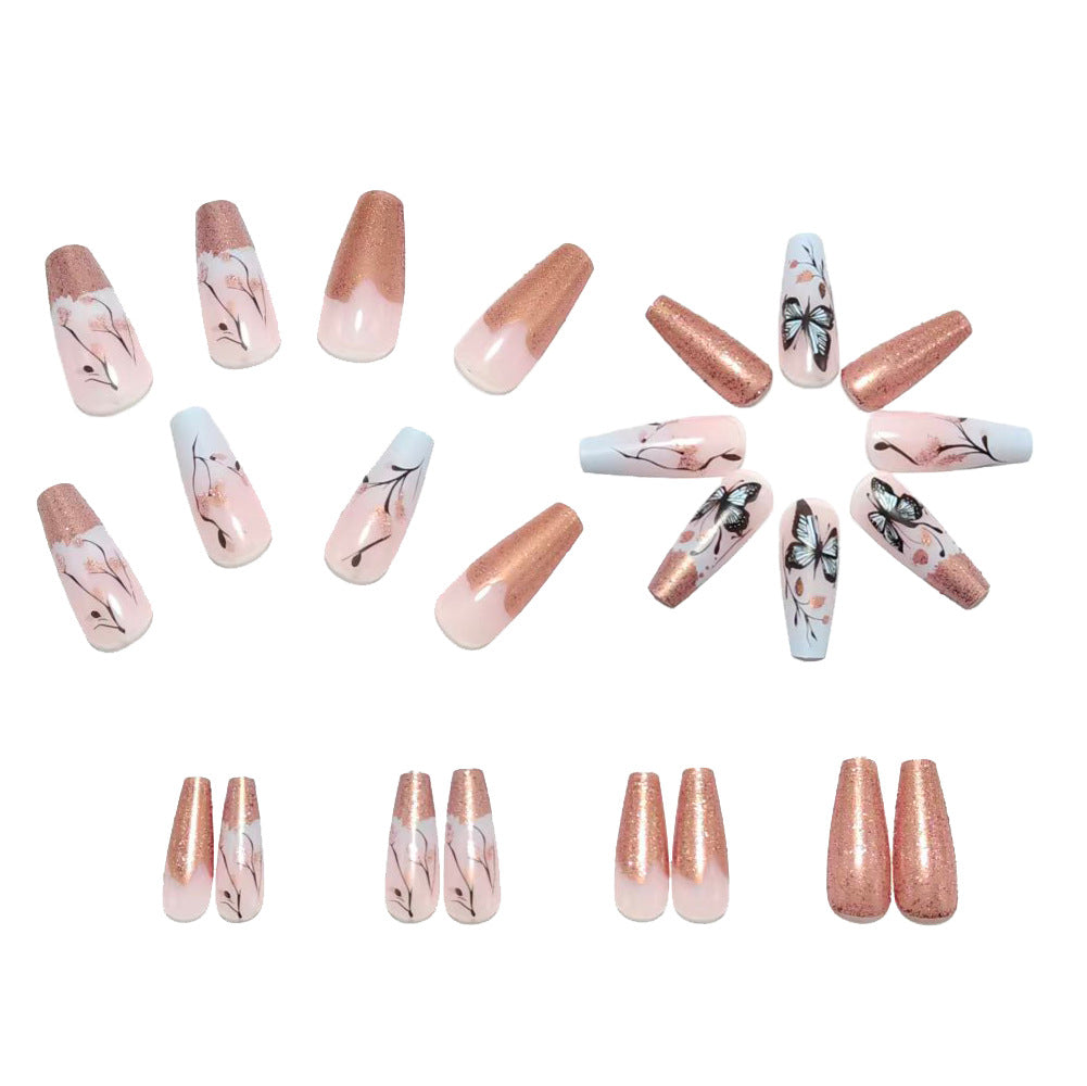 Artificial nails with filigree butterfly design and golden accents Bowlift