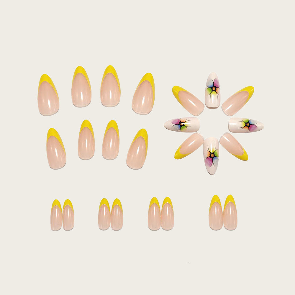 Stylish artificial nails with floral accents and colorful French tip design Bowlift