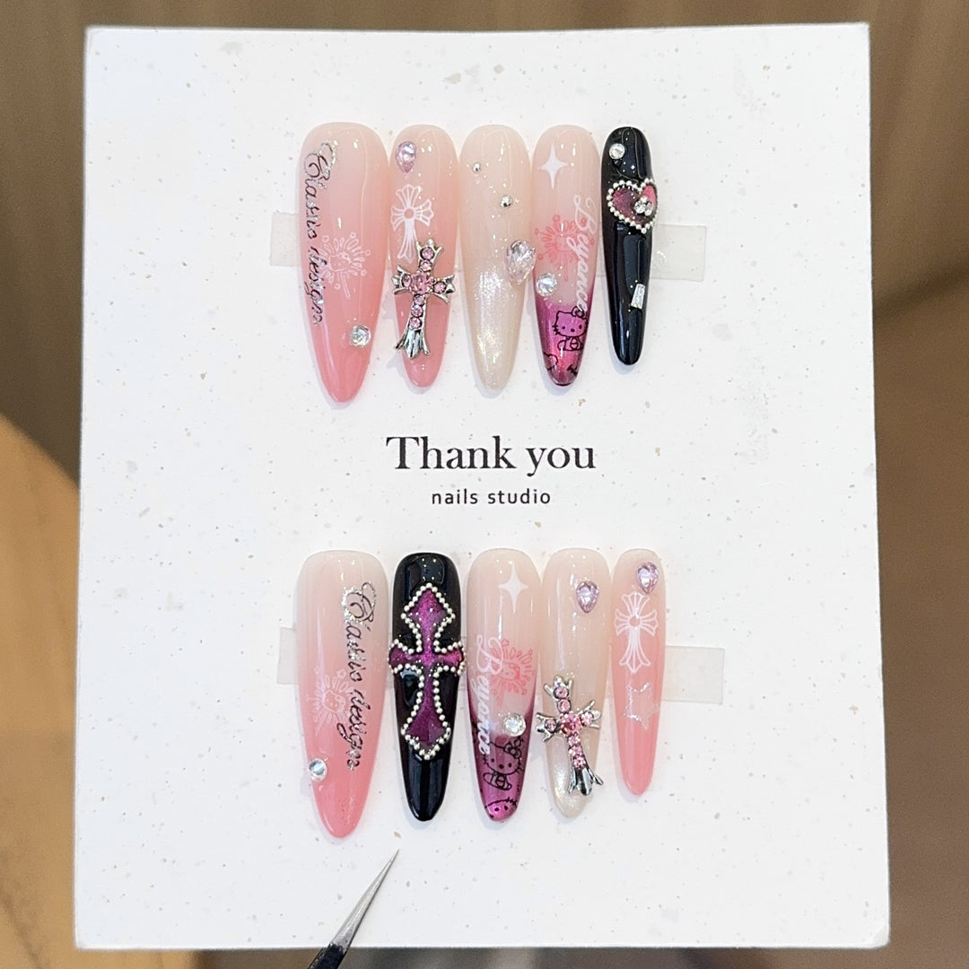 Artificial nails with glamorous accents and sparkling embellishments Bowlift