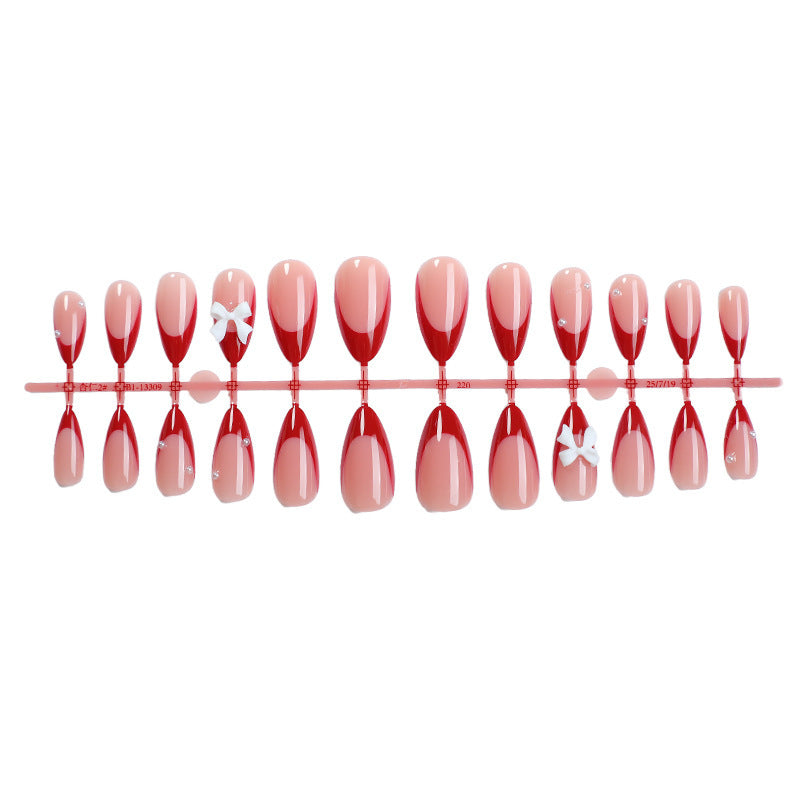 Artificial nail set with elegant bows and glitter accents Bowlift