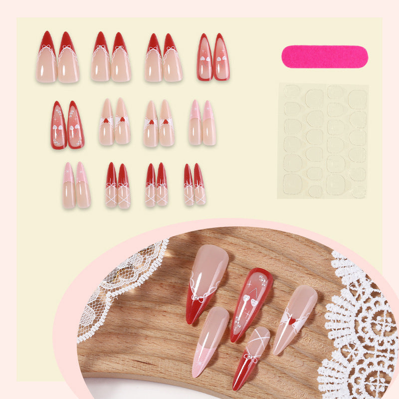 Artificial nail set with romantic heart and bow motifs Bowlift