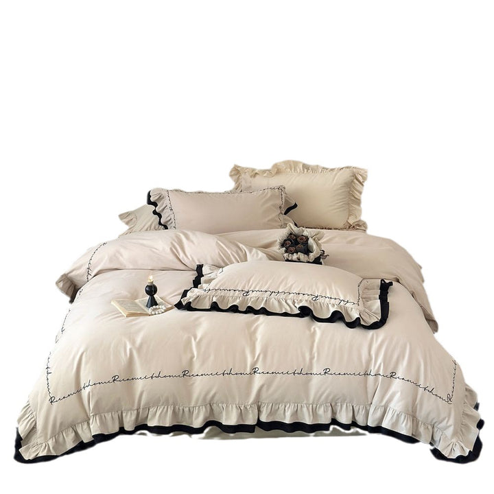 Luxurious bedding set with ruffle and text embroidery