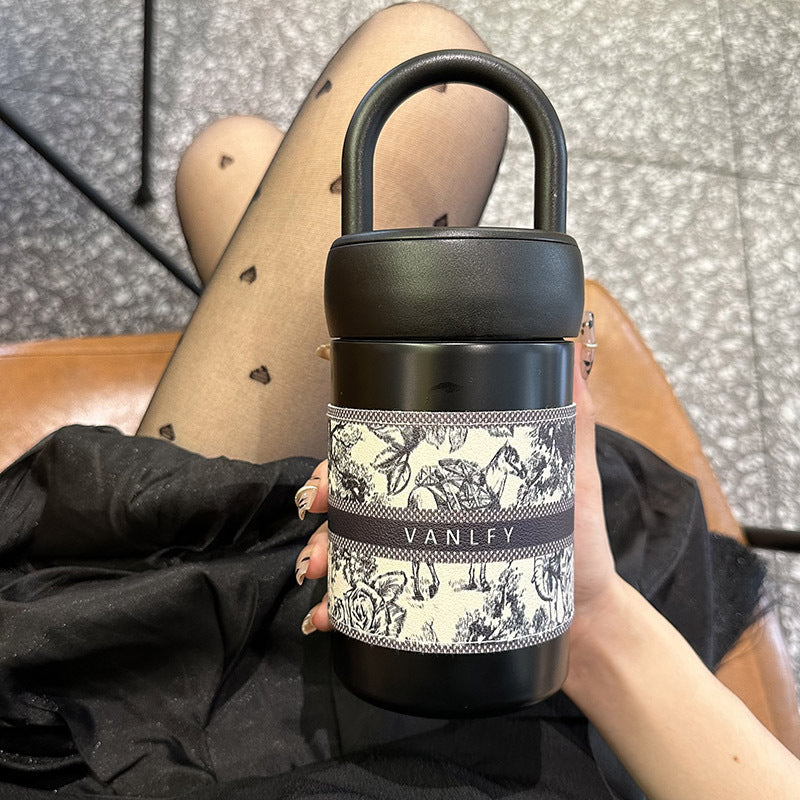 Women's stylish thermos cup with practical carrying handle Bowlift