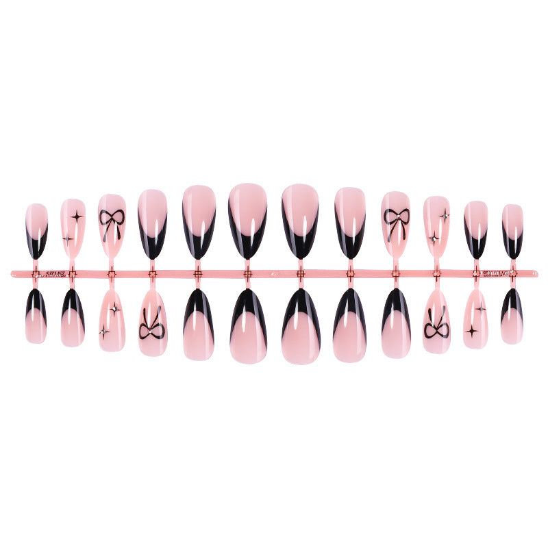 Artificial nail set with elegant cut and bow decorations Bowlift