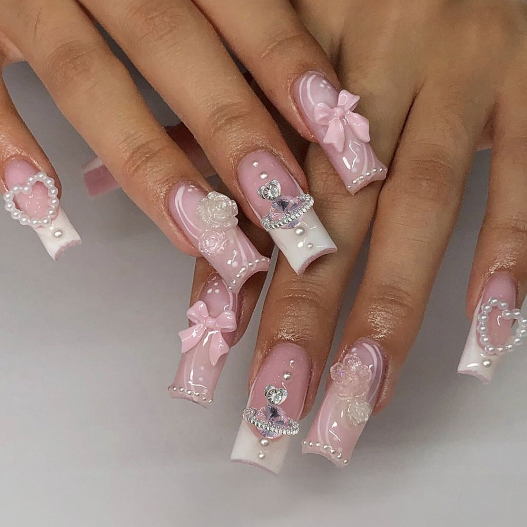 Creative acrylic nail set with delicate pearl and gloss accents Bowlift