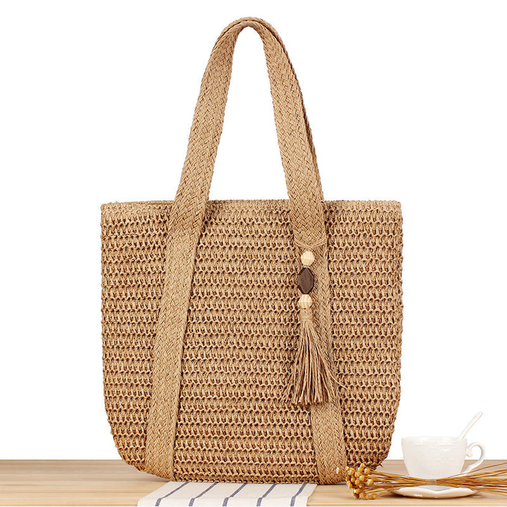 Eco-friendly straw tote bag with elegant tassel detail Bowlift