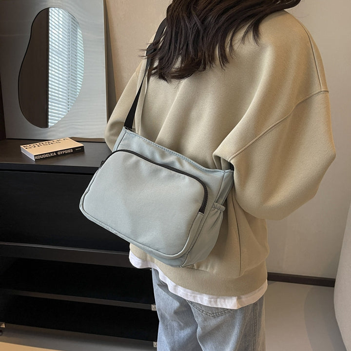 Practical shoulder bag with versatile storage compartments Bowlift