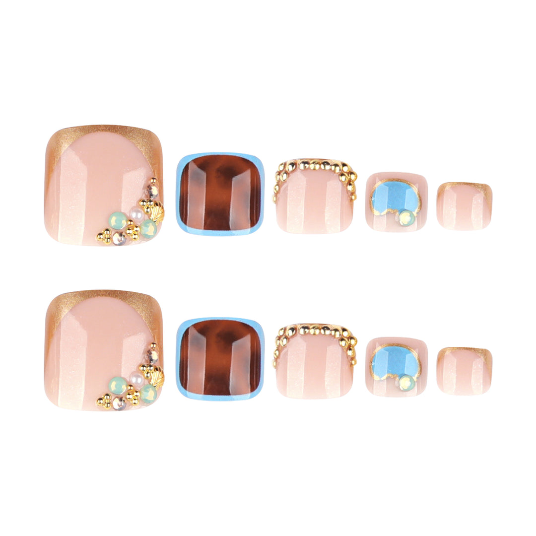 Artistic toenail art with elegant gold design Bowlift