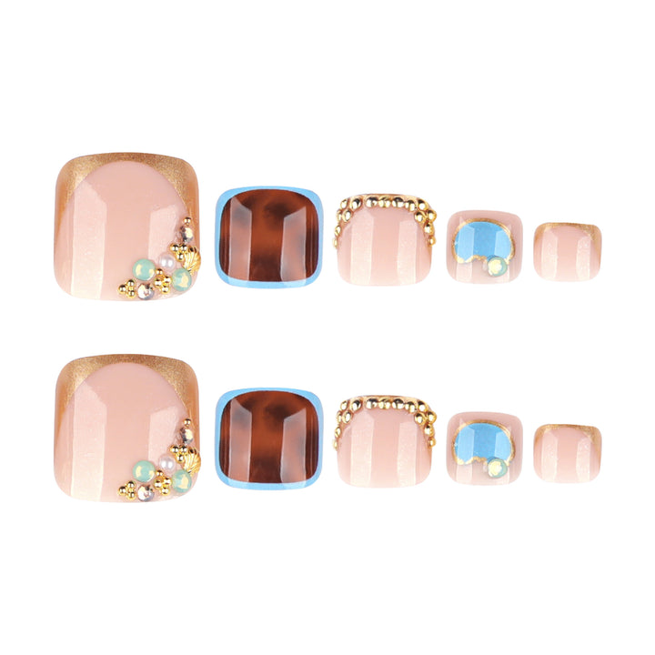 Artistic toenail art with elegant gold design Bowlift