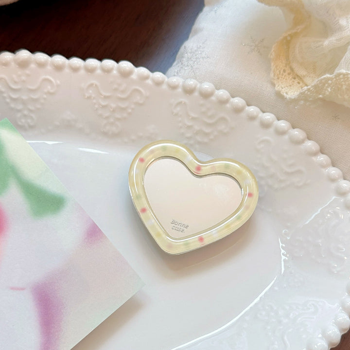 Hand mirror in heart-shaped design Bowlift