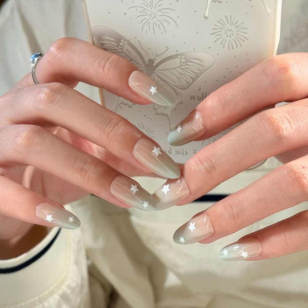 Artificial nails with elegant ombre effect and glitter coating Bowlift