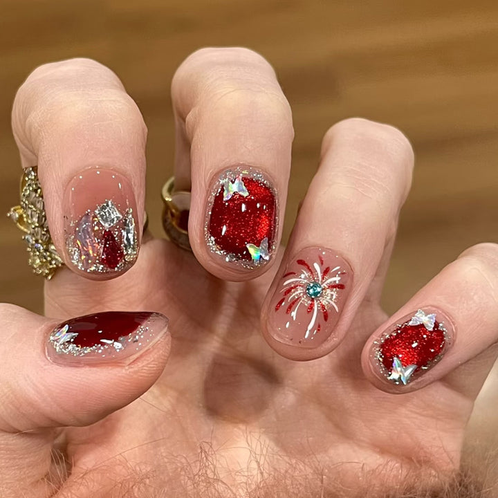 Artificial nail set with festive gift design and elegant glitter accents Bowlift