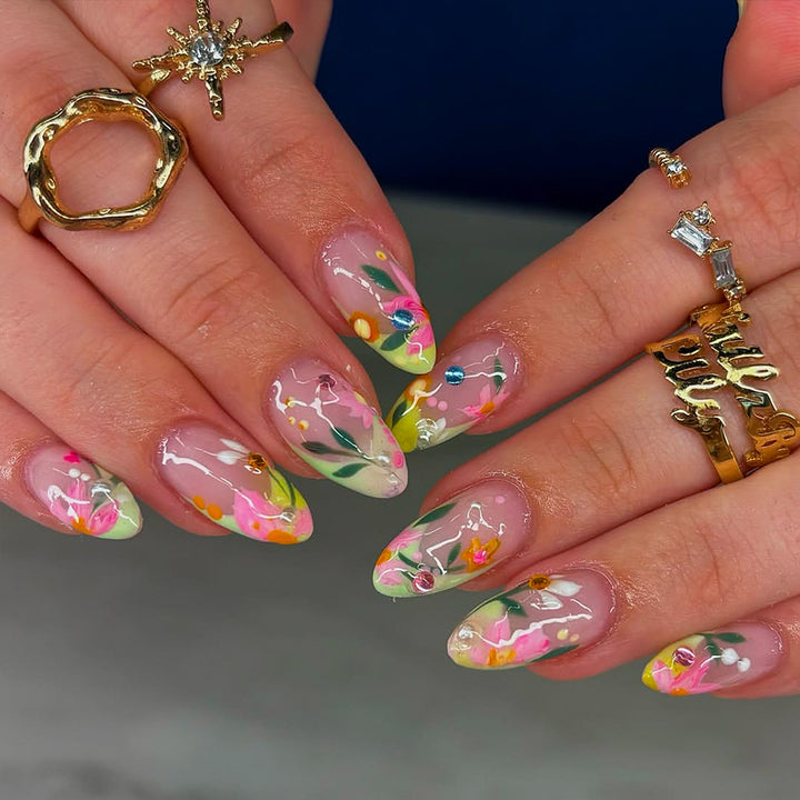 Artificial nails with flower design and glitter accents Bowlift