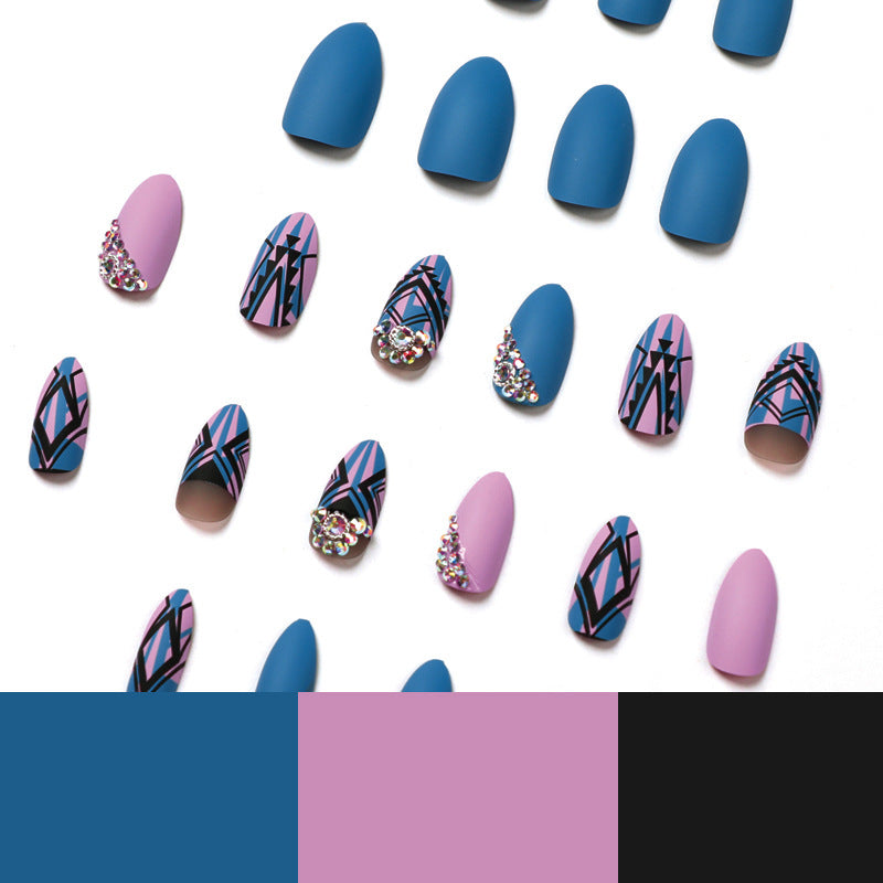 Artful stiletto nails with modern geometric designs and rhinestone embellishments Bowlift