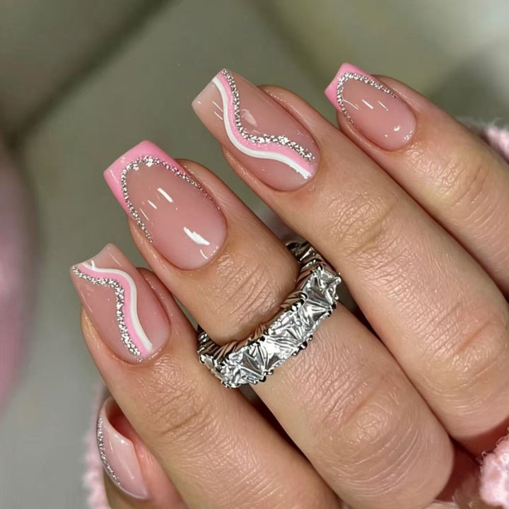 Artificial nails with elegant wave design and glitter accents Bowlift