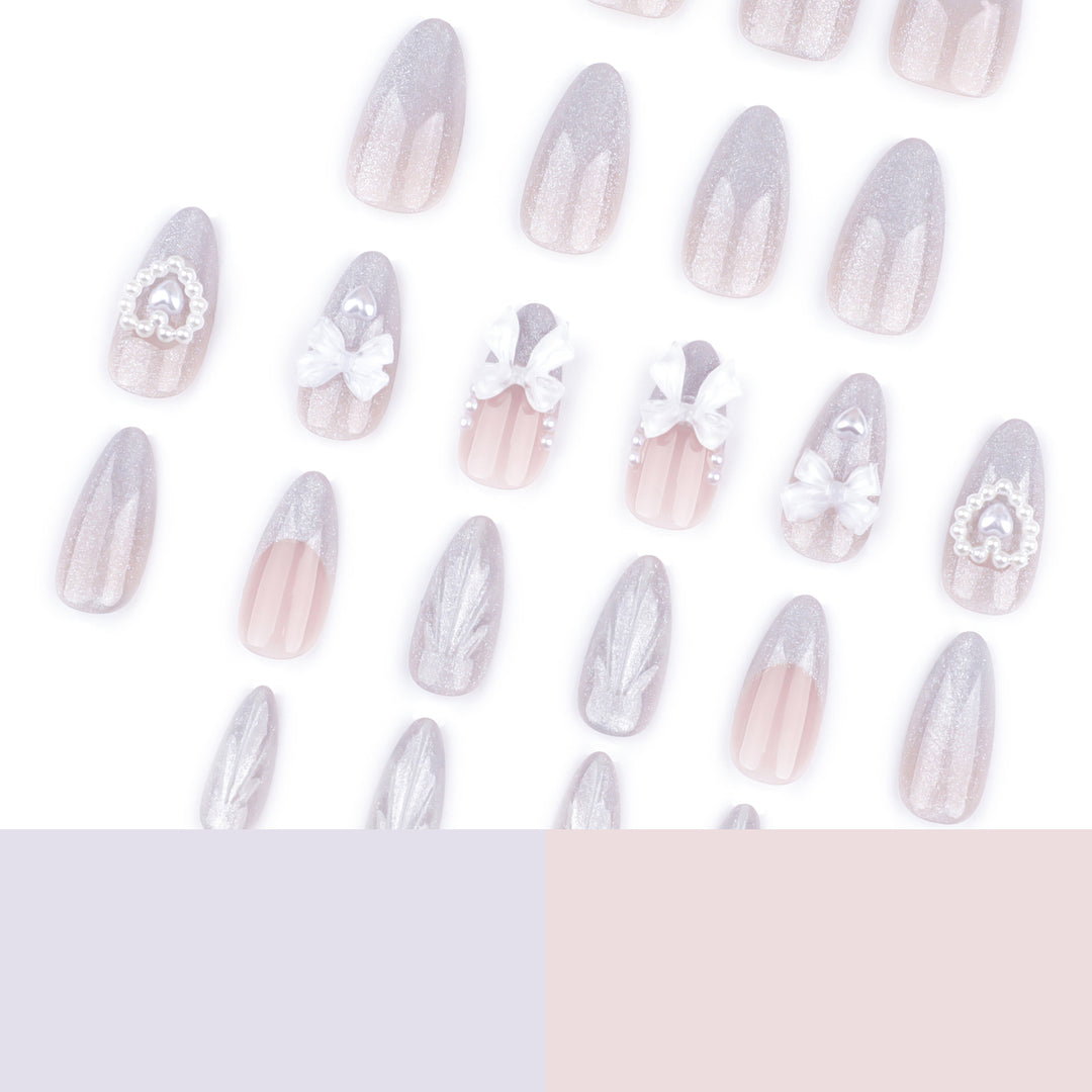 Artful nail decoration with pearl and bow accents Bowlift