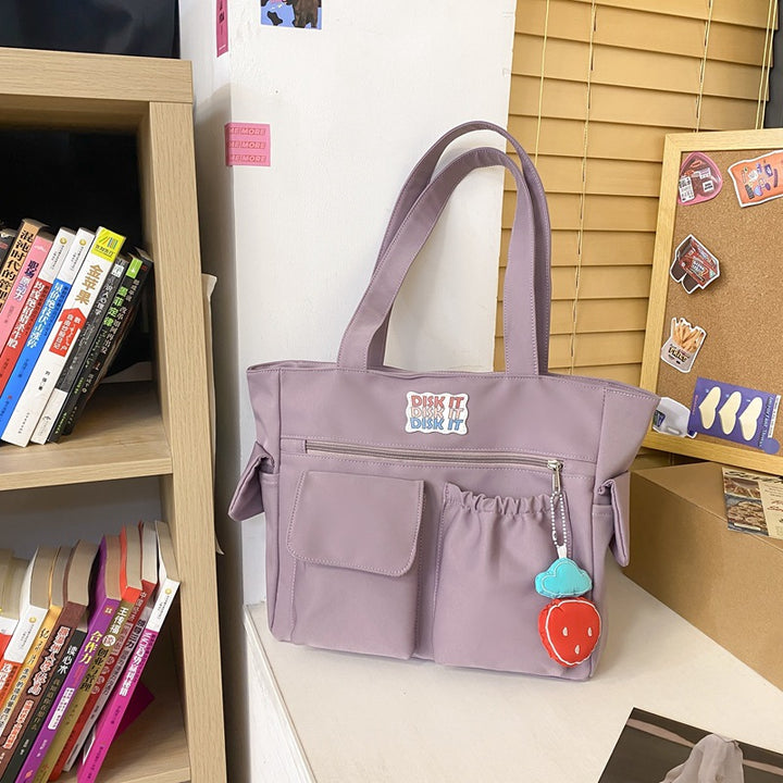 Tote bag with versatile compartments and ergonomic design Bowlift