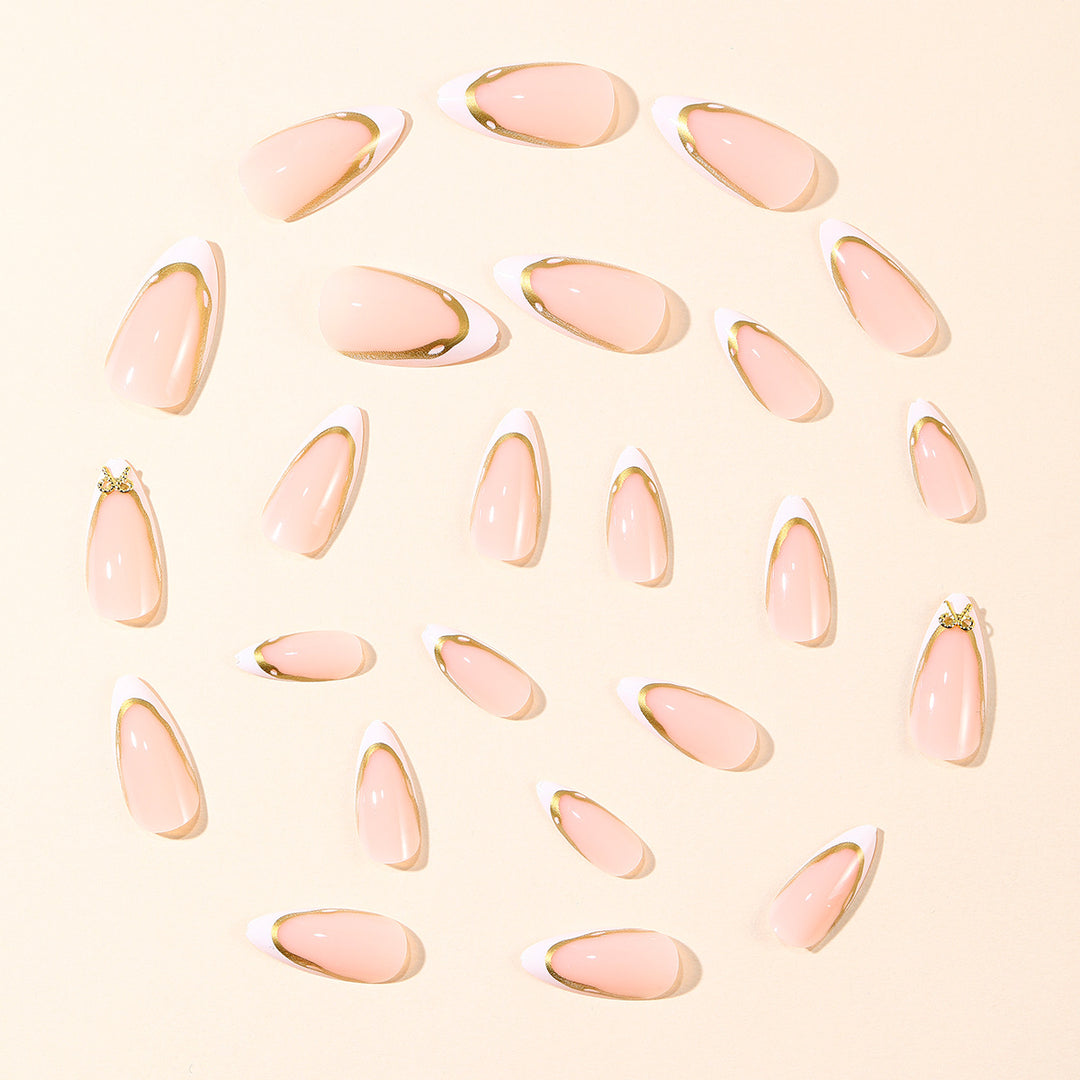 Elegant French Tip Nail Extensions with Gold Accents Bowlift