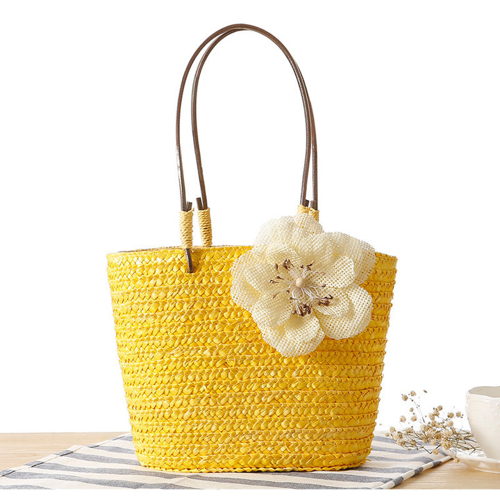 Elegant bast bag with flower appliqué Bowlift