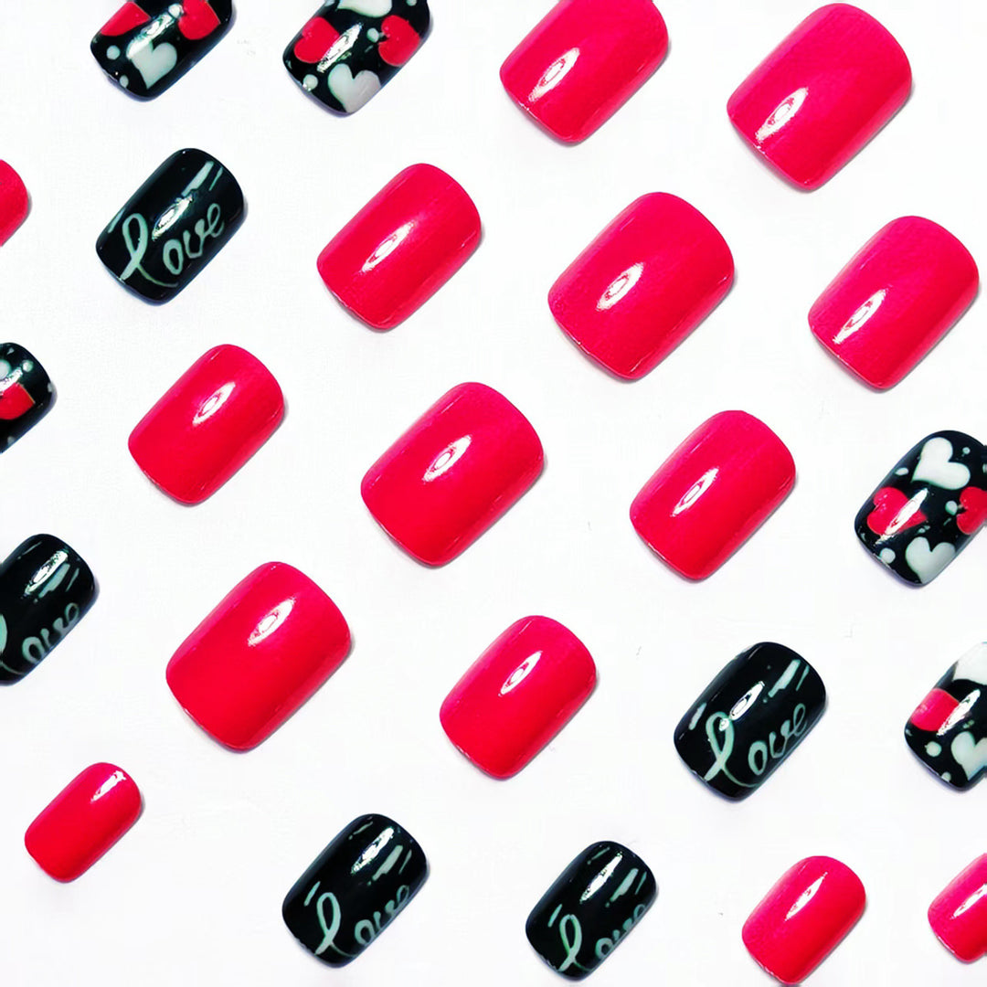 Acrylic nail design with hearts and kiss motifs Bowlift