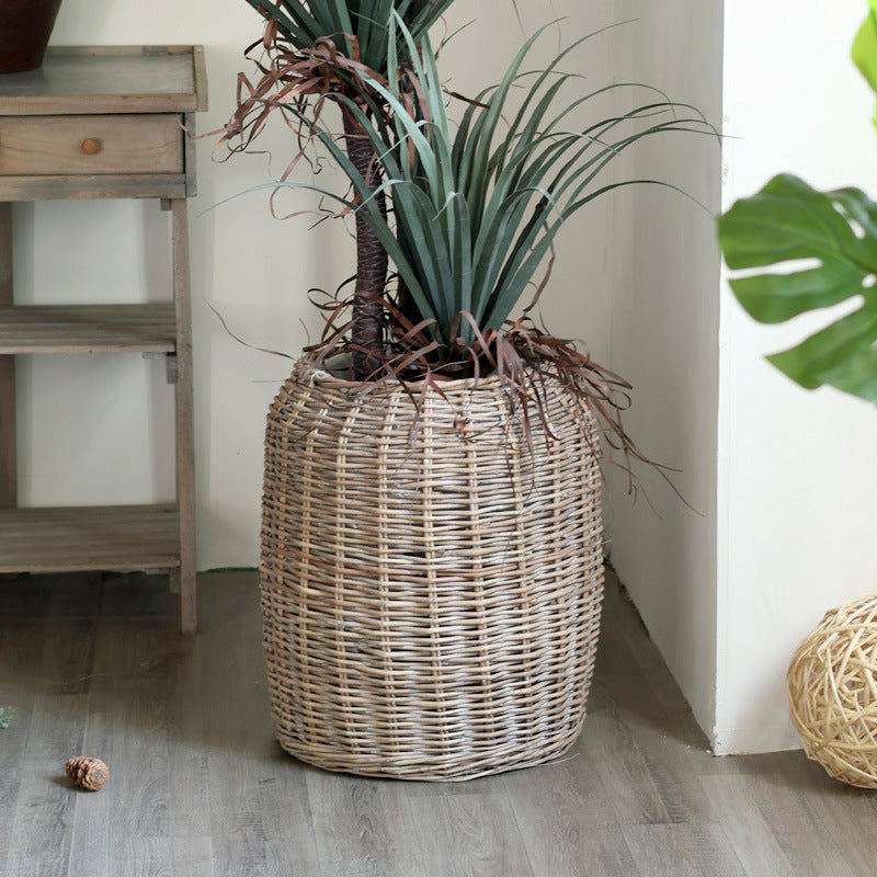 Stylish laundry basket made of braided natural material Bowlift