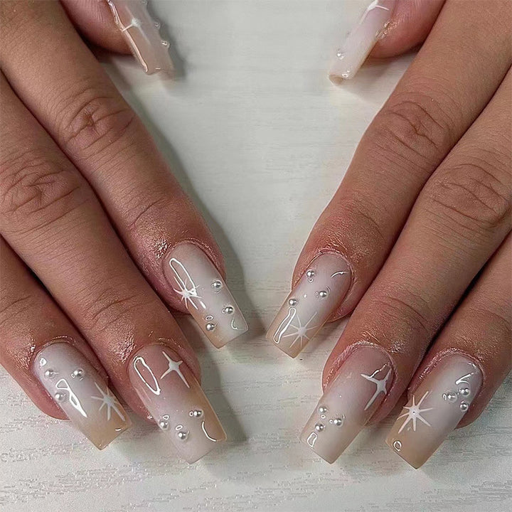 Artful Gel Nails with Elegant Floral Design and Glitter Accents Bowlift