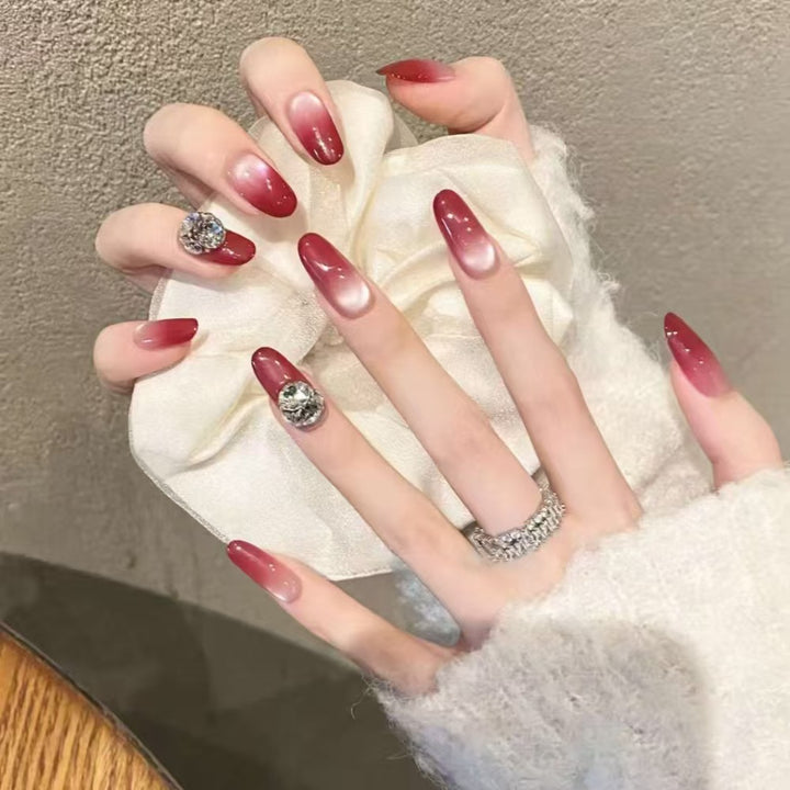 Artificial nails with elegant ombre effect and rhinestone decoration Bowlift