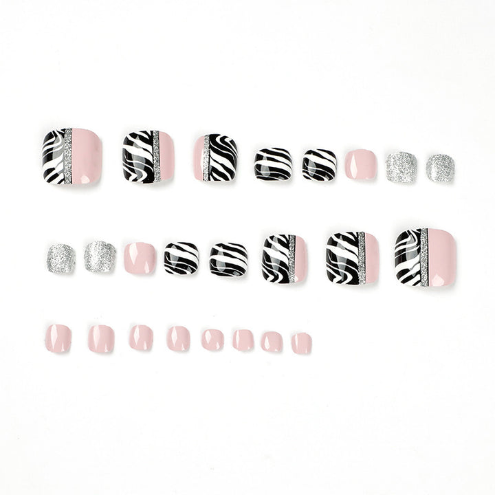 Artistic toenail art with zebra pattern and glitter accents Bowlift