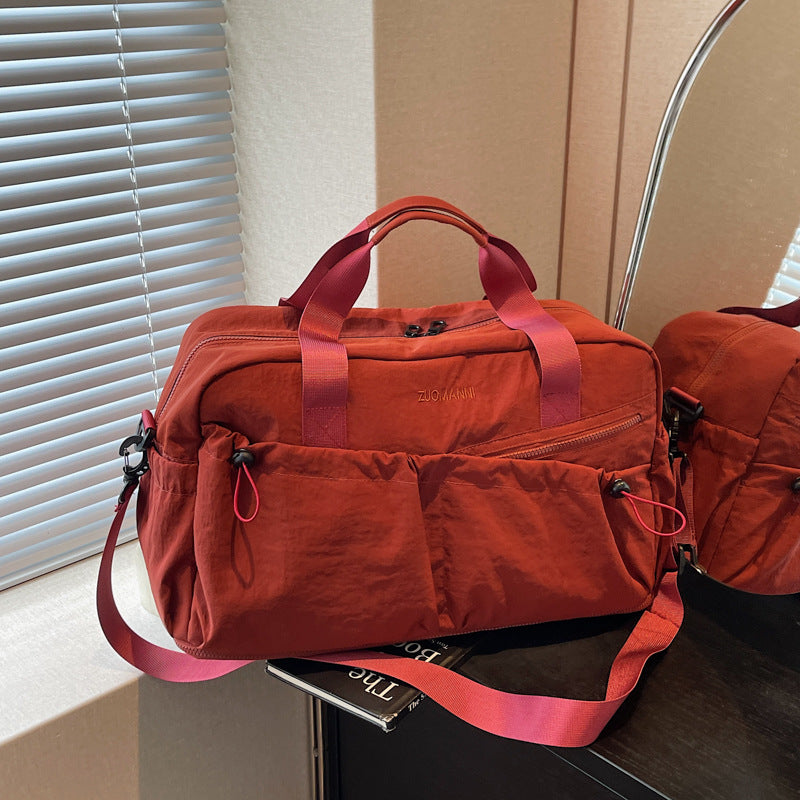 Sporty and Functional Travel Bag with Multiple Outer Pockets Bowlift