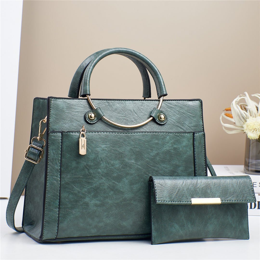 Elegant handbag with detachable shoulder strap and matching wallet Bowlift