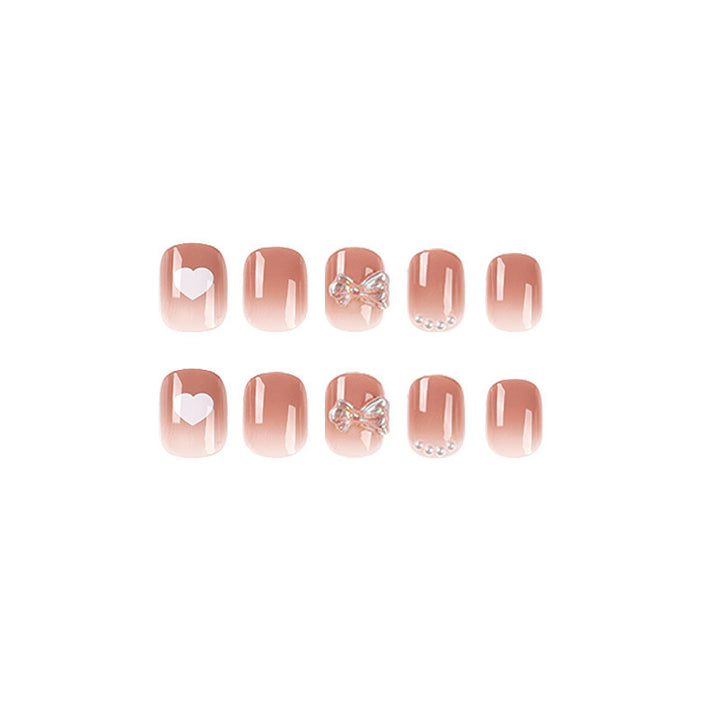 Artificial nails with romantic hearts and glitter accents Bowlift