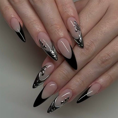 Artificial nails in elegant stiletto style with elaborate metal decoration Bowlift
