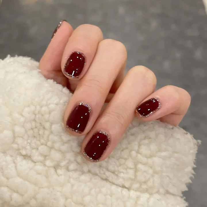 Glamorous artificial nails with heart design and glittering accents Bowlift