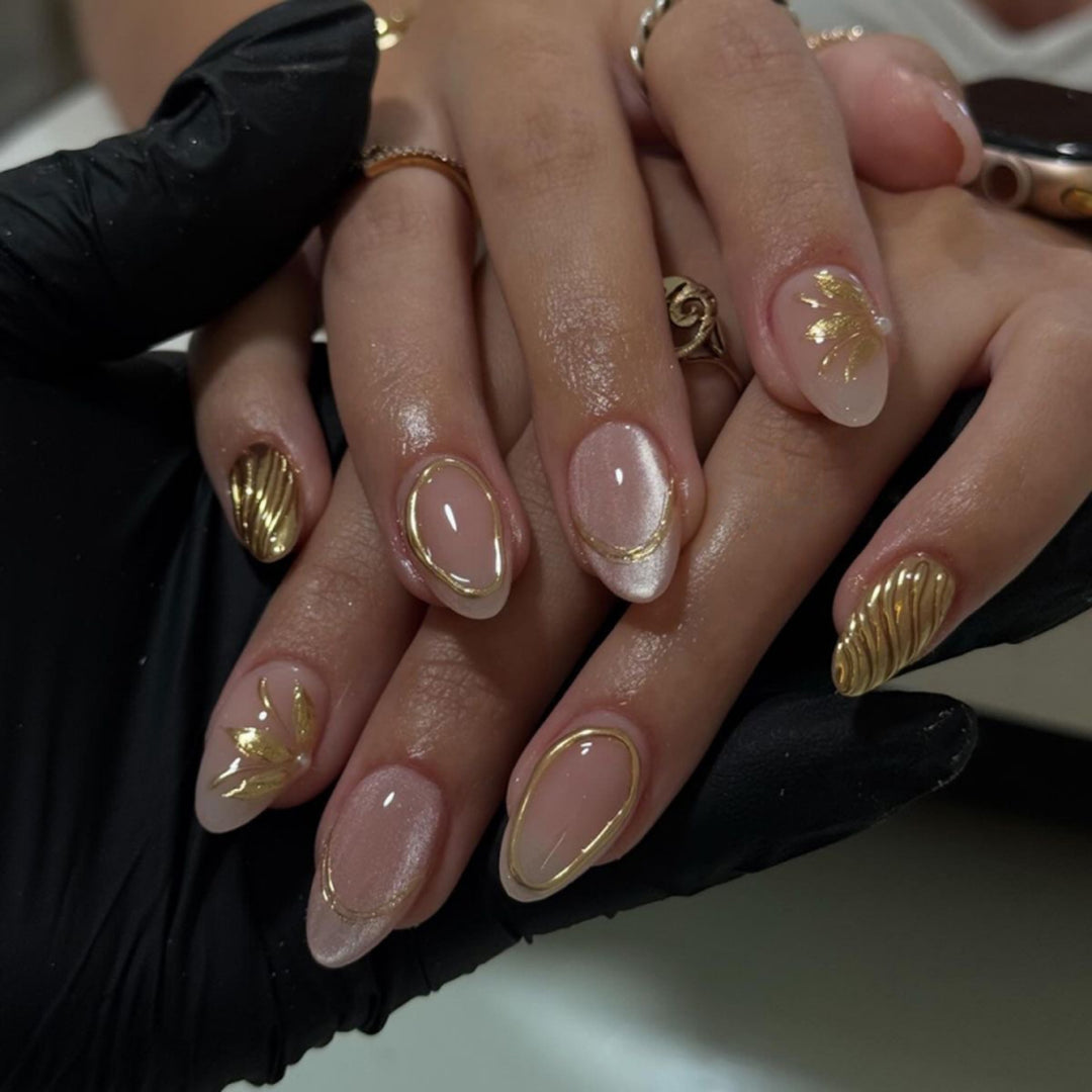 Elegant and artistic nail art with golden accents Bowlift