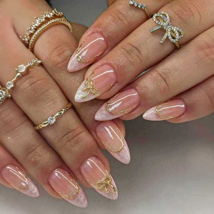 Artistic Pointed Press-On Nails with Gold Accents Bowlift