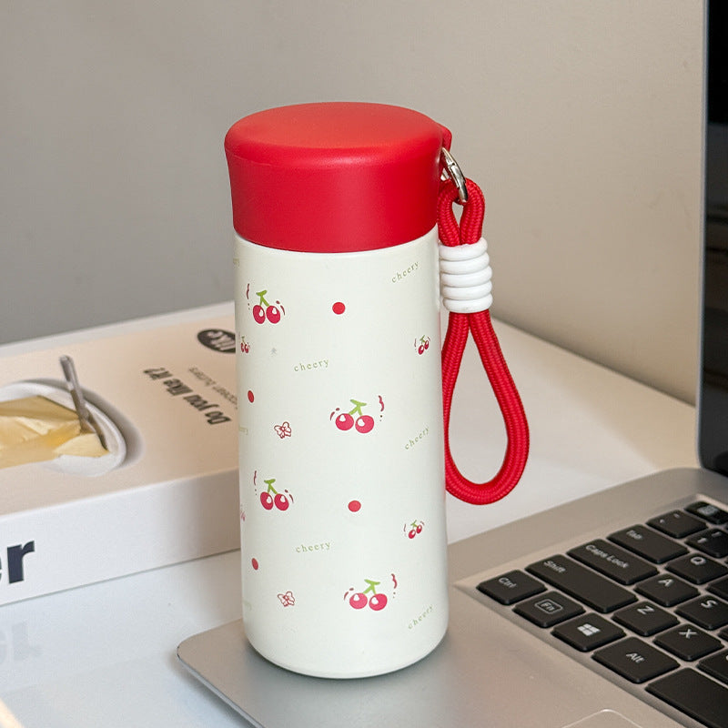 Women’s insulated drinking bottle with practical carrying strap and playful design Bowlift