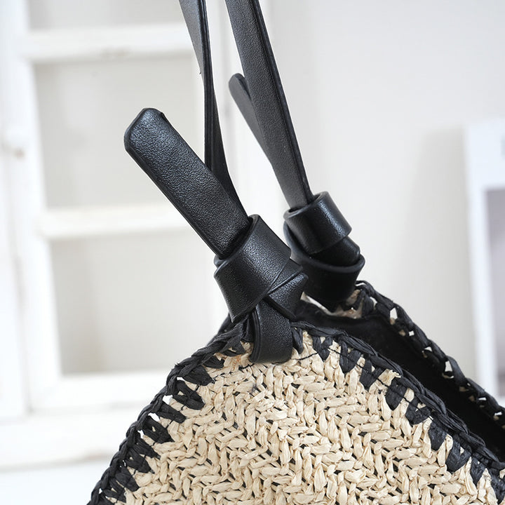 Handbag made of braided natural material with contrasting leather handles Bowlift