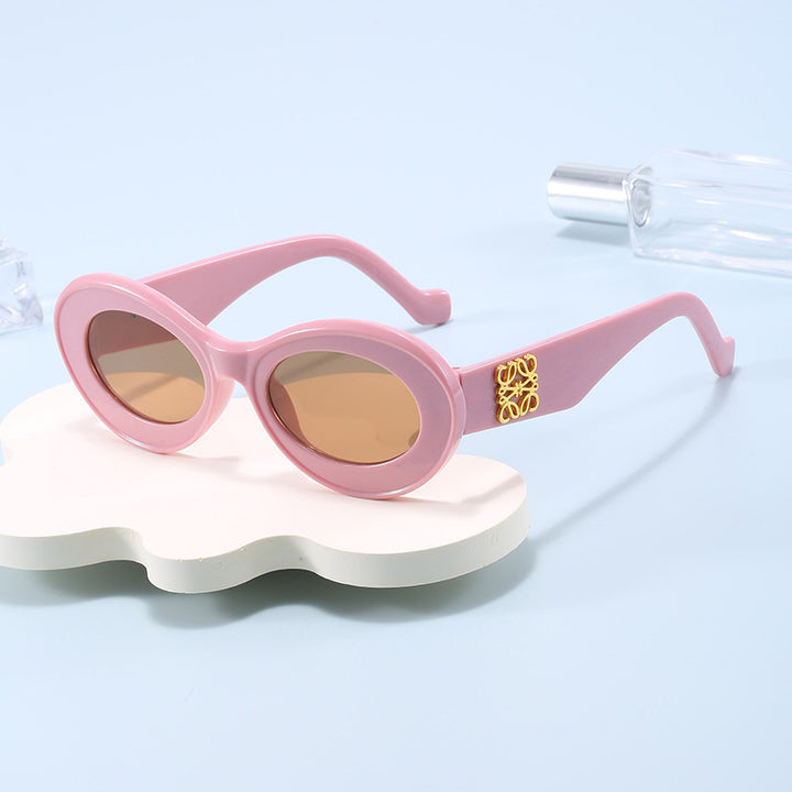Women's fashionable sunglasses with oval frame and golden applications Bowlift