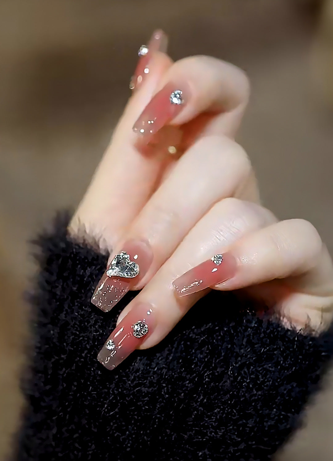 Acrylic nail set with elegant heart and rhinestone decorations Bowlift