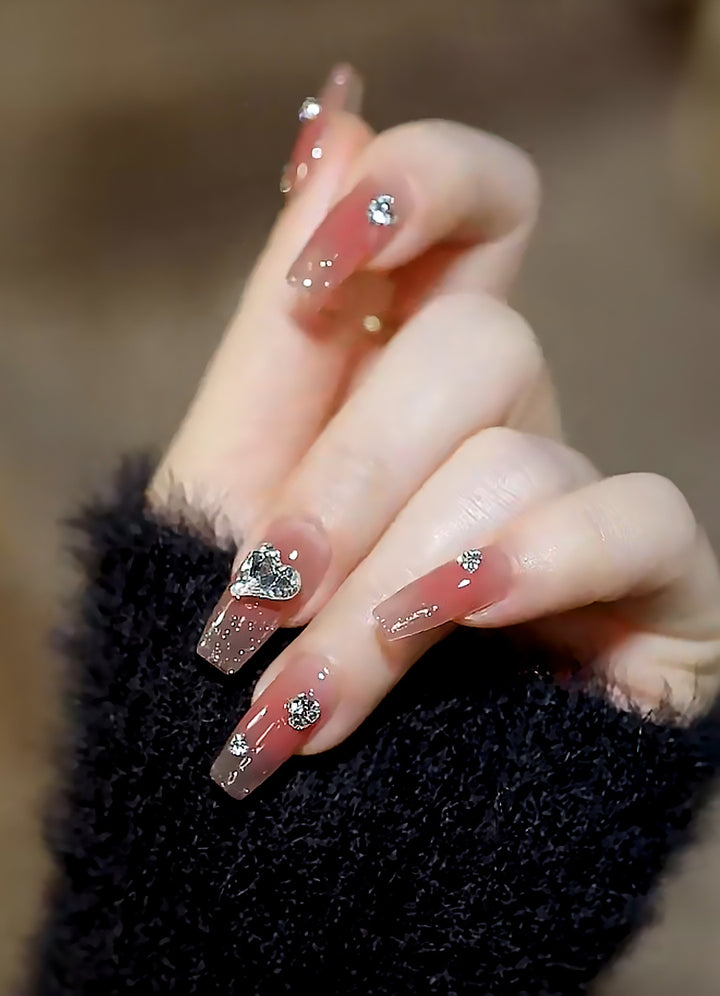 Acrylic nail set with elegant heart and rhinestone decorations Bowlift